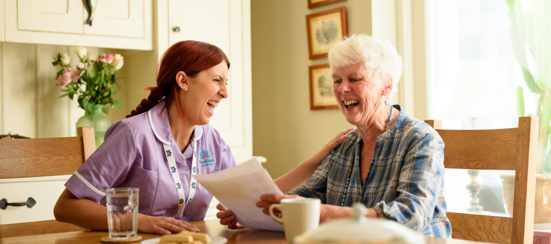 Laughing client and carer