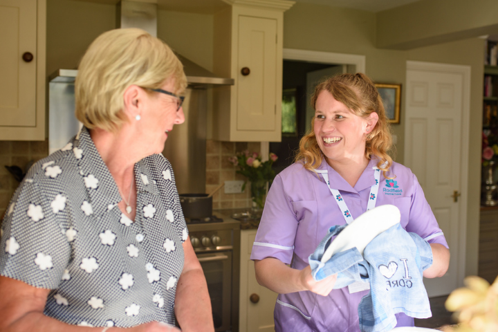 care professional drying the dishes