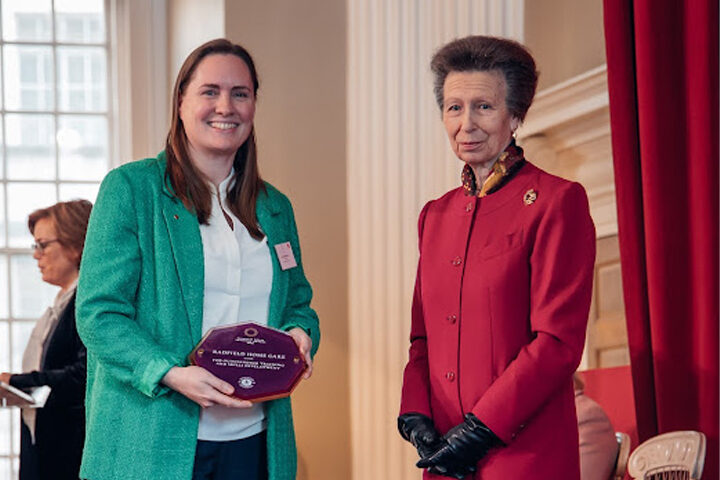 Hannah MacKechnie, founder of Radfield Home Care receives award from Princess Anne