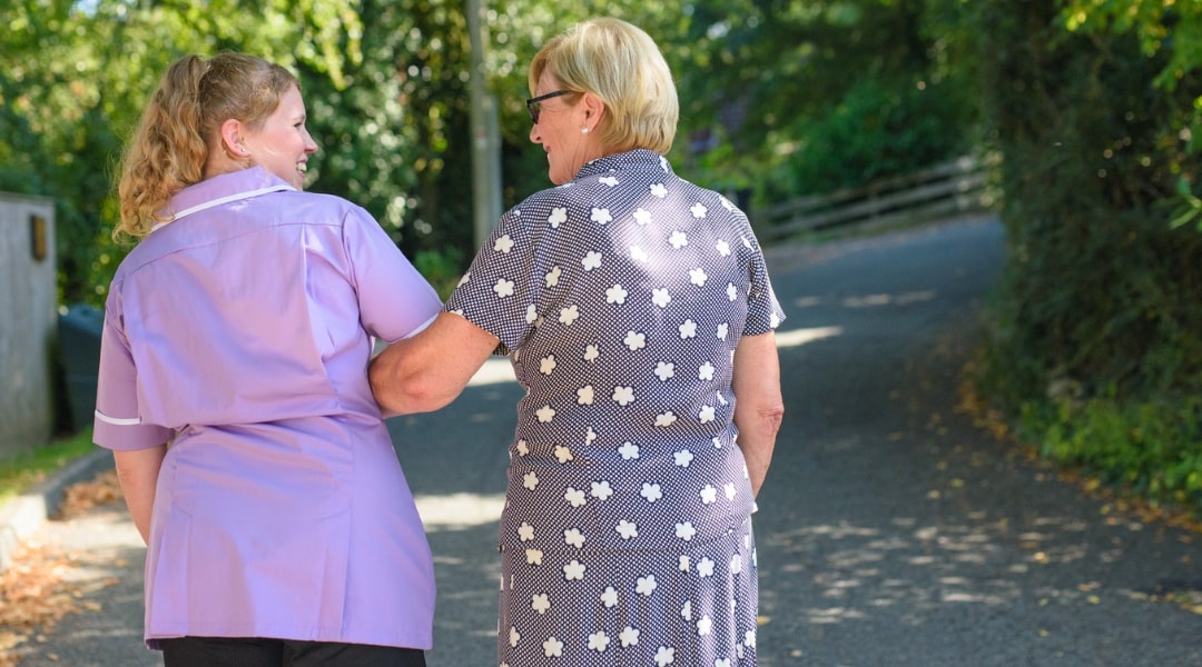 Care professional helping someone | Radfield Home Care