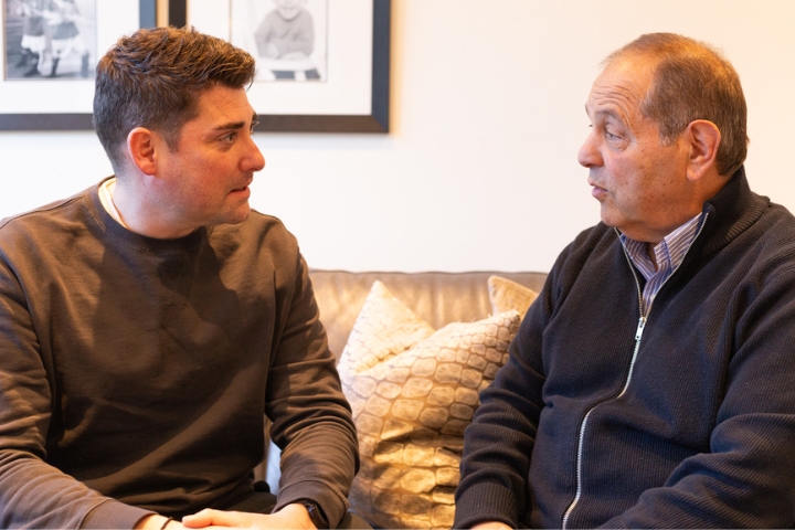 Male Care Professional talking to Male Client