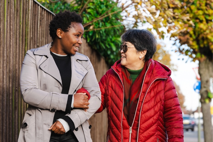 Female Carer walking with Female Client
