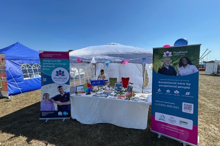 Radfield team smiling at community event in Wycombe.