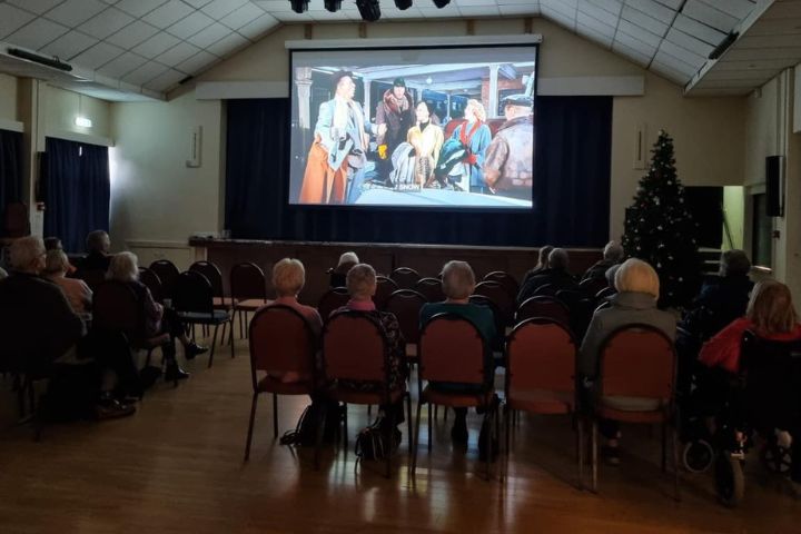Ilkley older community enjoying a Christmas film together