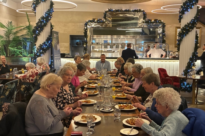 Group photo of The Fountains Independent Living residents, Radfield Home Care Liverpool North and Sefton team, Karen Berry, and guests enjoying the festive dining outing at The Grand in Southport.