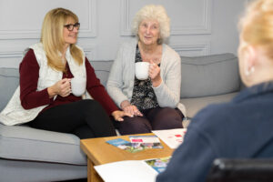 3 people discussing Questions to ask when searching for care at home in 2026