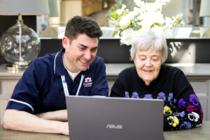 Image depicting a Care Professional with a Client researching what does a care professional do in 2026