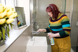 Care Professional cleaning a client's bathroom