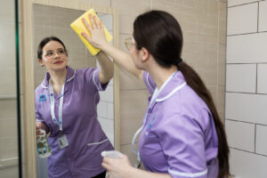Care Professional cleaning mirror