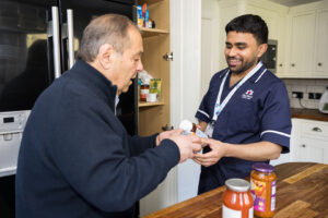 Care Professional helping out an elderly client