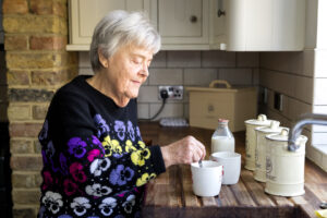 Image depicting an elderly parent, showing signs of cognitive function decline