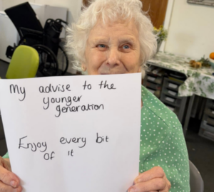 A client holding up a piece of paper