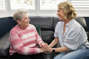 2 people discussing severe disability premium and carers allowance