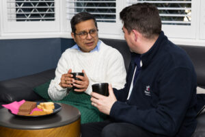 Unpaid family carer helping a relative