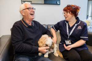 A Care Professional helping her client with social isolation in older people