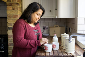Care professional making a cup of tea - topic of what changes when home care starts