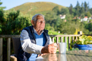 image of a parent sitting alone - thinking about why loneliness in old age in 2026 is so common