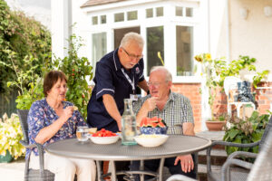 A Care Professional talking through kitchen safety risks in older parents