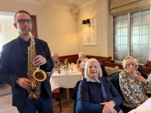 Picture of Saxophonist Alistar Grant helping tackle loneliness in older people in Liverpool