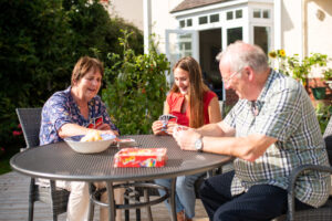 3 people discussing how to talk to older parents about care