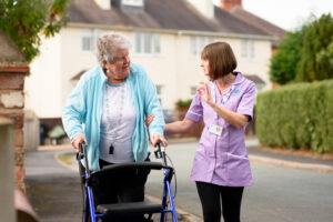 2 people walking and discussing what to expect from palliative care at home 