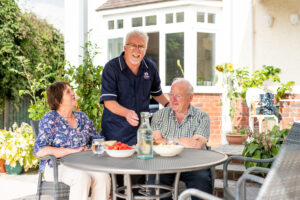 Care Professional and 2 clients discussing benefits of palliative care at home