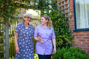 A client being taken on a walk by a Care Professional in Derby while their family carer takes a respite break
